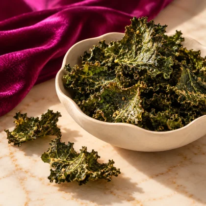 Close-up of seasoned whole-leaf kale crisps in a bowl