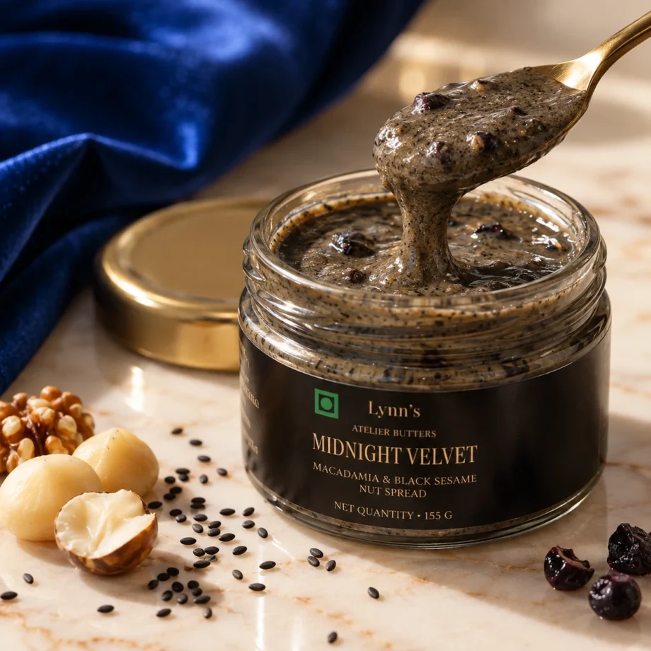Jar of Lynn's Midnight Velvet macadamia and black sesame butter with a spoon