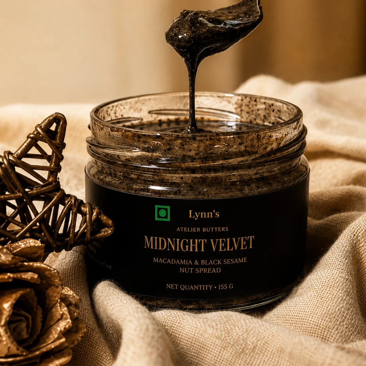 Midnight Velvet Macadamia black sesame butter in a spoon